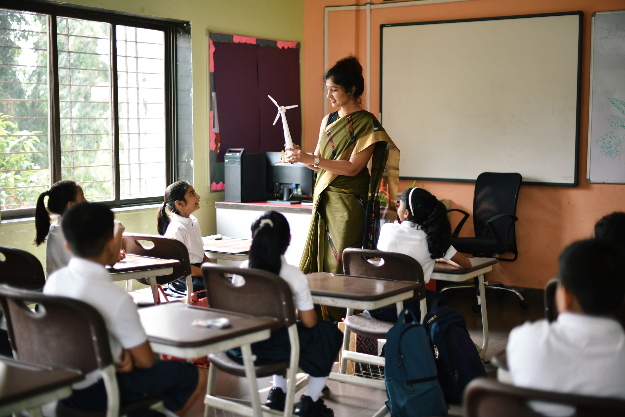 Teacher leading an engaging classroom lesson with students